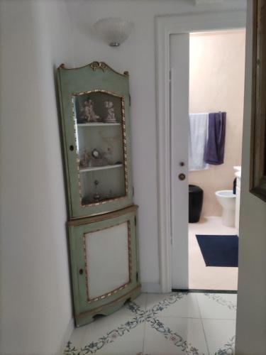 a green cabinet in a room with a bathroom at U' Pizzico ( the pinch ) in Capri