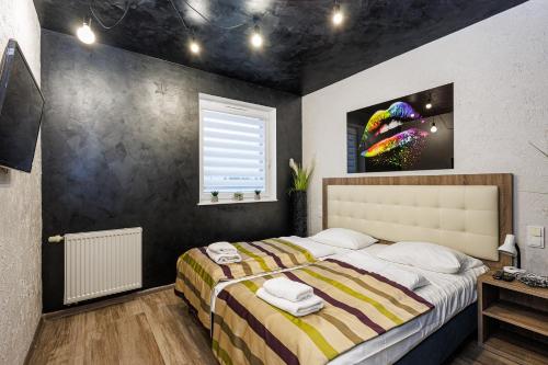 Ένα ή περισσότερα κρεβάτια σε δωμάτιο στο Baltic Cliff Apartamenty