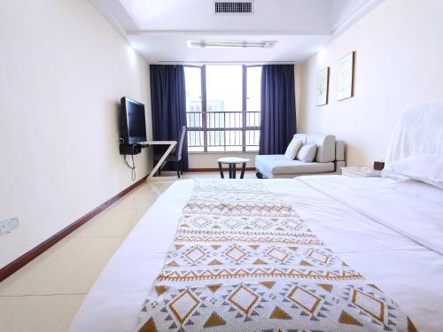 Postel nebo postele na pokoji v ubytování Guangzhou Uhome Service Apartment