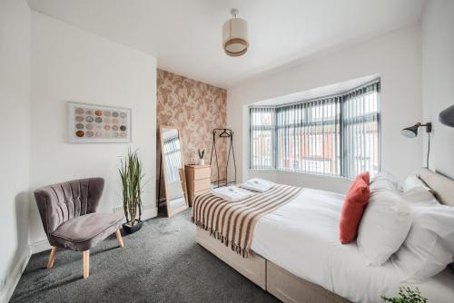 Ένα ή περισσότερα κρεβάτια σε δωμάτιο στο 4 BR House - Coventry - Wifi