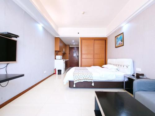 TV a/nebo společenská místnost v ubytování Guangzhou Uhome Service Apartment