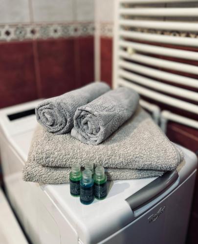 a pile of towels sitting on top of a sink at 514 DISTRICT in Hunedoara