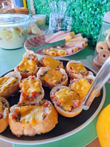 a plate of food with food on a table at Pousada Vida Simples in São Francisco do Sul