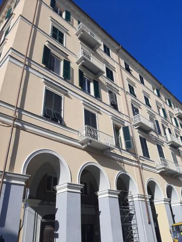 a large building with arches on the side of it at Residenza Viani Guest House in La Spezia
