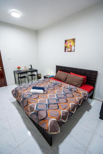 a large bed sitting in a room with at A Home Away From Home in Abu Dhabi