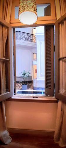 a window in a room with a potted plant at Esplendor by Wyndham Savoy Rosario in Rosario