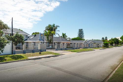 a row of houses on a street at Africa Beach B&B in Port Elizabeth
