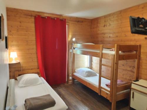 Ένα ή περισσότερα κρεβάτια σε δωμάτιο στο Chalet spacieux 15 places