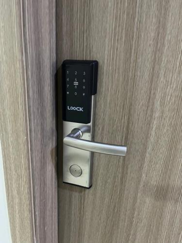 a door opener with a remote control in it at Aras Solace Place in Trece Martires