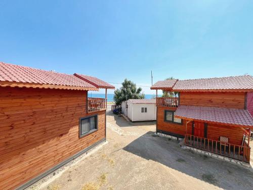 an aerial view of two wooden buildings next to each other at Manzara Bungalow in Demre