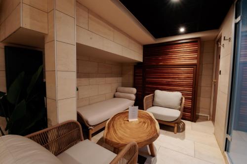 a room with a table and two chairs at Keystone Hôtel & Spa in Lyon