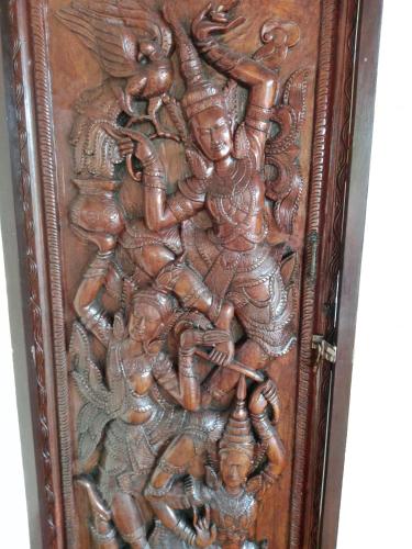 a wooden door with a painting on it at Baan Tropicana in Mae Nam