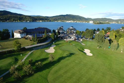 an aerial view of a golf course with a lake at Haus Klement in Velden am Wörthersee