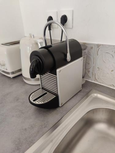 a coffee maker sitting on top of a kitchen counter at Studio évasion - SPA, Mer et Calanques in Carnoux