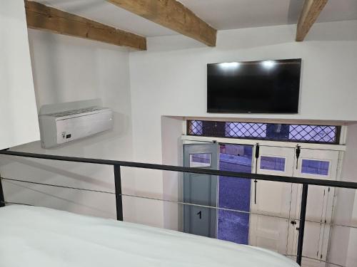 En eller flere senge i et værelse på Suite San Fernando