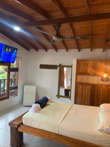 Una cama o camas en una habitación de Hotel Tekal del Rio