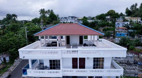 an aerial view of a white house with a red roof at Villas Hillside apt 4 in Santa Bárbara de Samaná