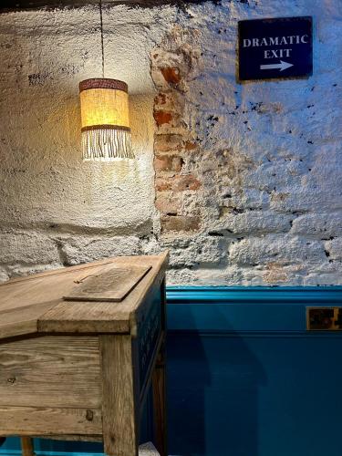 a table in a room with a sign on the wall at The Bridge House in Bridport