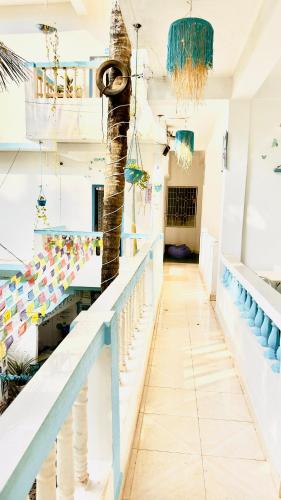 a room with a palm tree on the wall at Viik wellness inn -3 Star Resort in Arambol Beach in Arambol