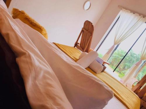 a bedroom with a bed and a window at Buckswood Hilltops in Stegi
