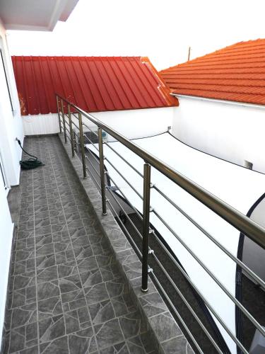 a staircase in a building with a red roof at Angelica Residence in Gennadi