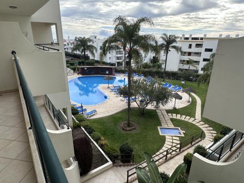 a view of a swimming pool from a building at BayView Albufeira in Albufeira