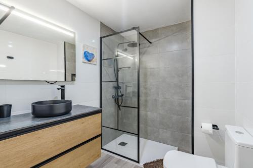 a bathroom with a shower and a sink at Sea View Albatros Golf del Sur in San Miguel de Abona