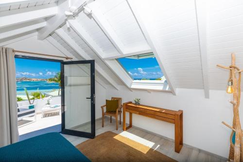 a room with a desk and a view of the ocean at The views from the home were beautiful in Cul de Sac
