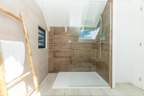 a shower with a glass door in a bathroom at The views from the home were beautiful in Cul de Sac