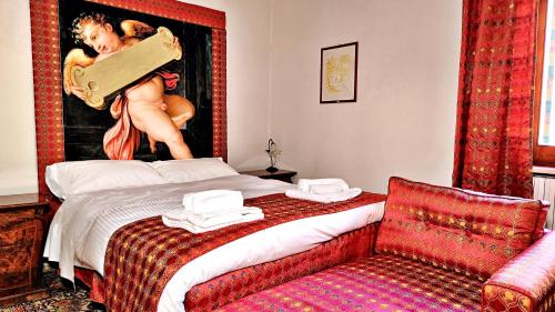 a bedroom with a bed with a woman holding a suitcase at Artist's Suites in Spoleto