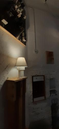 a lamp sitting on a table in a room at ToronySzoba in Szob