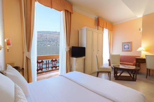Postel nebo postele na pokoji v ubytování Hotel Pallanza by LVG Hotel Collection
