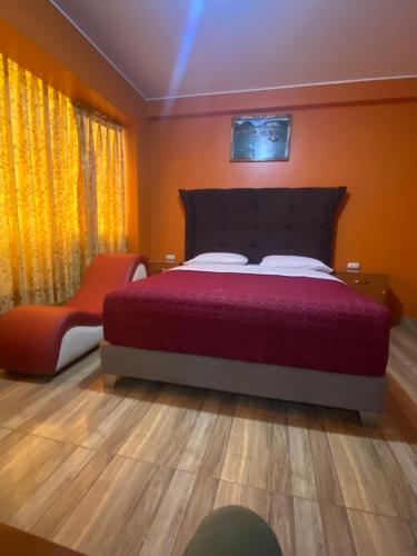 Ένα ή περισσότερα κρεβάτια σε δωμάτιο στο Hostal El Amazonas 03