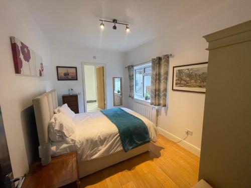 a bedroom with a bed and a window at Blissful Slumber in Ruskington