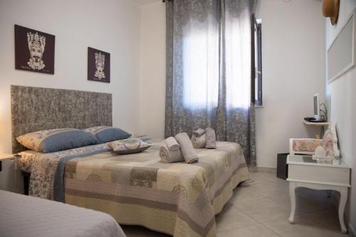 Postel nebo postele na pokoji v ubytování House turkish scale- benvenuti al sud