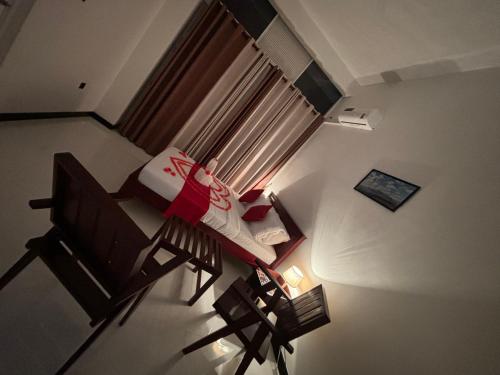 an overhead view of a room with a chair and a window at Kandy Alpine Breeze in Kandy