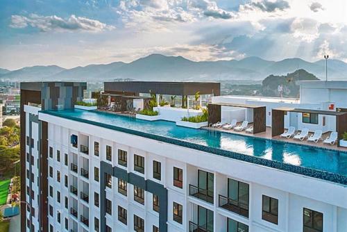 a large building with a swimming pool on top of it at horizon ipoh in Ipoh