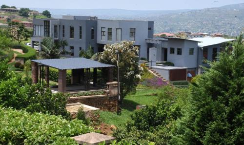 a house with a gazebo in a yard at At TheSoil in Edendale