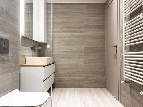 a bathroom with a sink and a toilet in it at VILLA 8 By ProLiving Hospitality in Thessaloniki