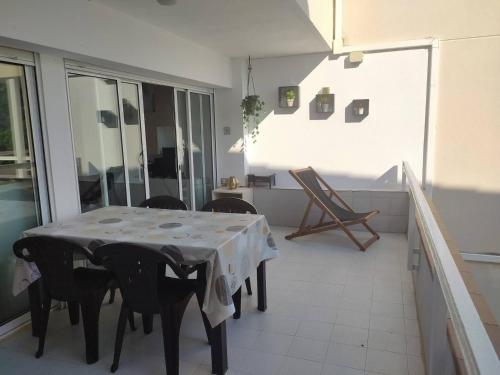 a dining room with a table and some chairs at Xalana con terraza y magnificas vistas al mar in Girona