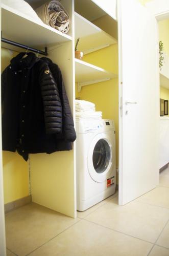 a laundry room with a washer and dryer at QuickHome - Appartamento Mazzini in Biella