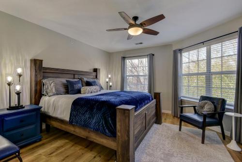 a bedroom with a bed and a ceiling fan at Luxurious Condo at Holiday Hills Resort - Beautifully Updated and Affordable - Family Amenities - No Steps in Branson