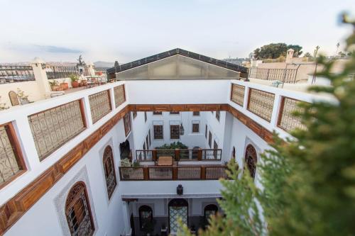 an aerial view of a building with a balcony at Riad - Dar Al Andalous in Fès