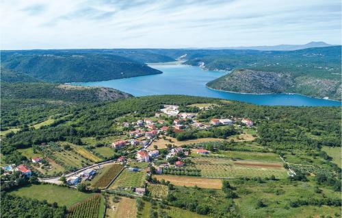 an aerial view of a town next to a lake at Holiday Home Mate Balota Cr in Rakalj