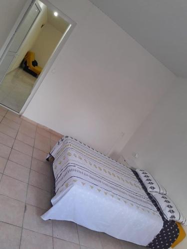 a mattress sitting on the floor in a room at Charming F2 in Sainte-Anne
