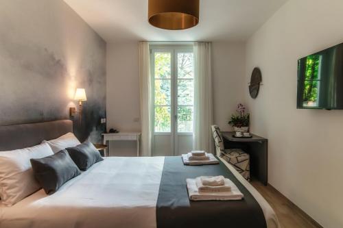 Una cama o camas en una habitación de Hotel Ristorante La Vignetta Cernobbio