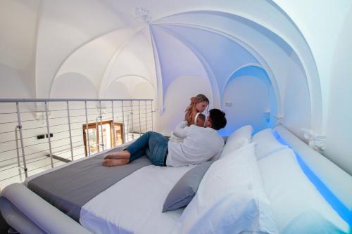 A bed or beds in a room at Inferno e Paradiso