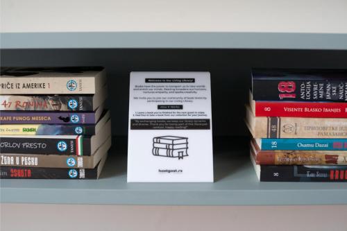 a stack of books sitting on a shelf at Gorska Vila in Kopaonik
