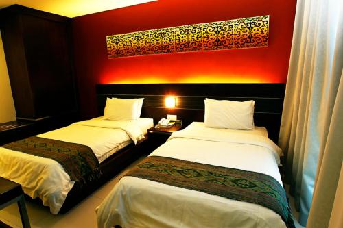 Katil atau katil-katil dalam bilik di Kinabalu Daya Hotel