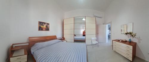 Ένα ή περισσότερα κρεβάτια σε δωμάτιο στο Incantevole villa al mare